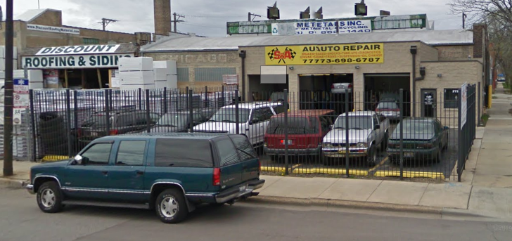 Ortiz Auto Repair shop exterior showing storefront with business sign and customer vehicles
